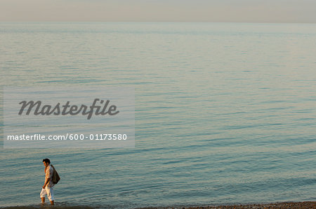 Man Walking on Beach