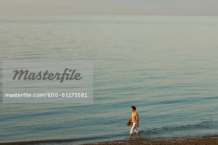 Man Walking on Beach