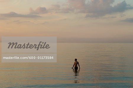 Man Standing in Ocean