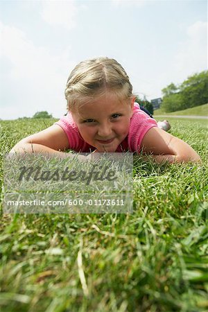 Girl Lying Down on Grass