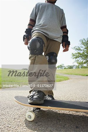 Boy Standing on Skateboard