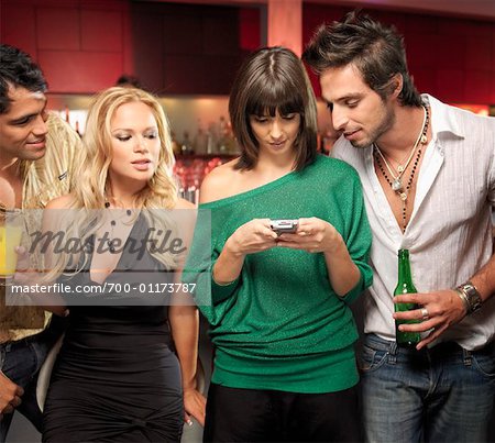 Friends Text Messaging in Bar