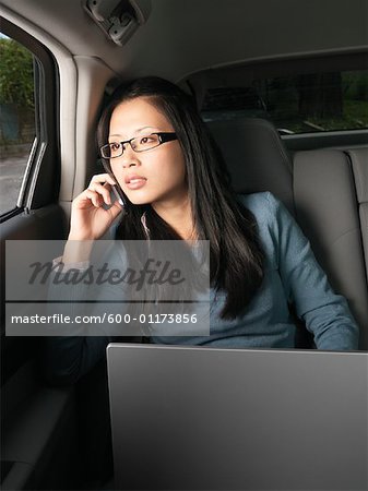 Businesswoman Working in Car