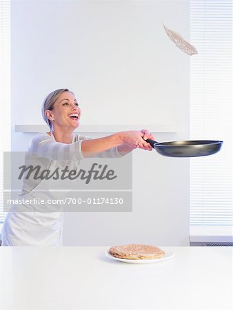 Woman Flipping Pancake