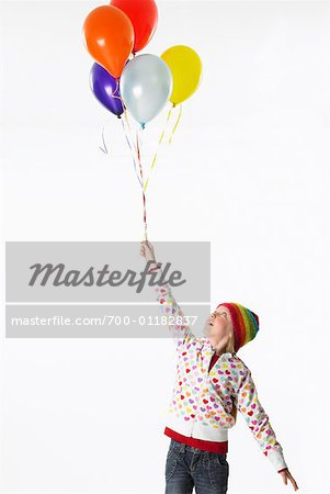 Girl Holding Balloons