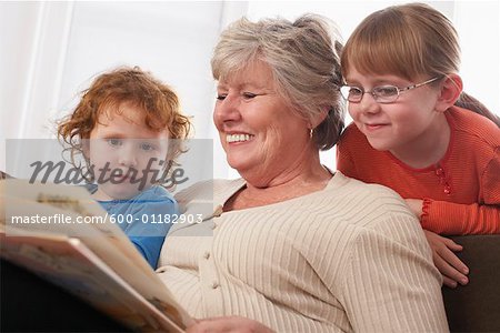 Woman Reading with Granddaughters