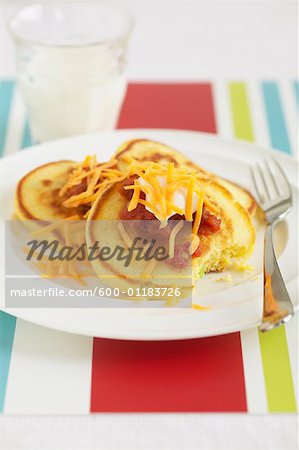 Pancakes on Plate with Cheese and Sour Cream