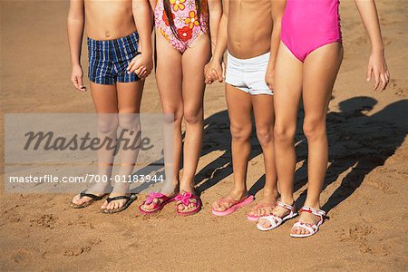 Children Standing on Beach