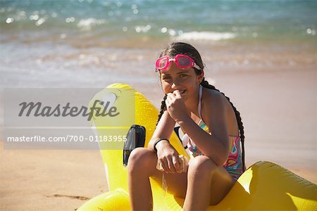 Girl Sitting on Inflatable Toy