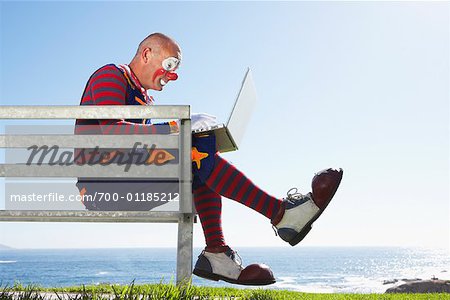 Clown Using Laptop Computer