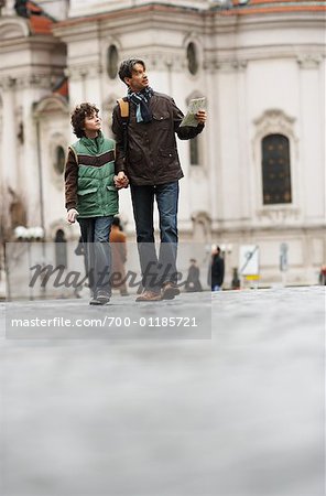 Father and Son Walking on Street