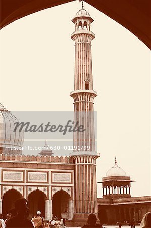 Rear view of a group of people in the courtyard of a mosque, Jama Masjid, New Delhi, India