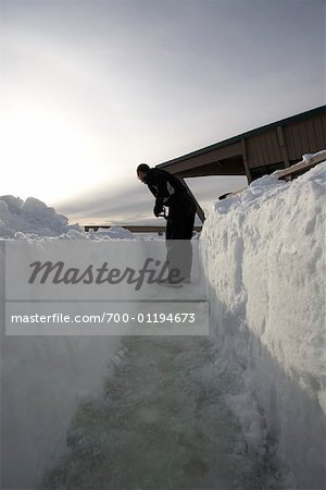 Man Shovelling Snow
