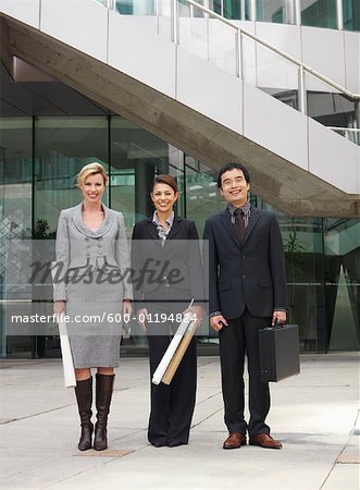 Portrait of Business People in Front of Building