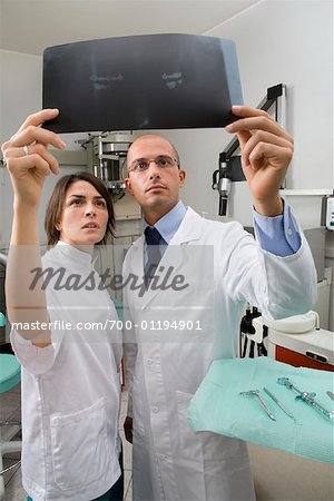 Dentists Looking at X-Ray