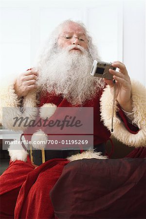 Santa Claus holding Digital Camera