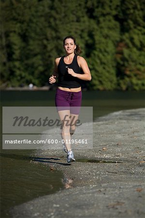 Woman Running on Beach