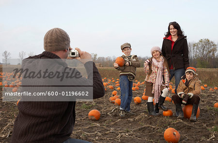 Man Taking Photograph of Family
