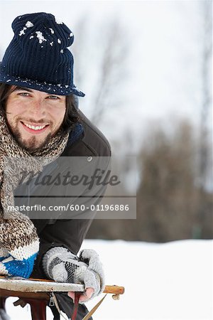 Portrait of Man on Sled