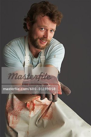 Portrait of Butcher with Meat