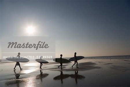 Family with Surfboards at Beach