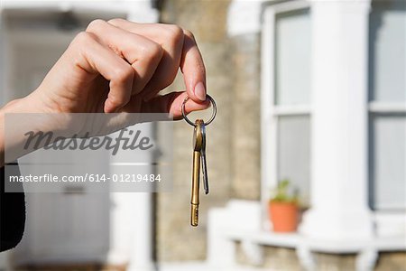 Person with keys to house