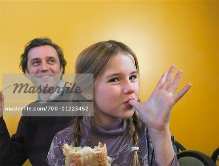Father and Daughter Eating Fast Food