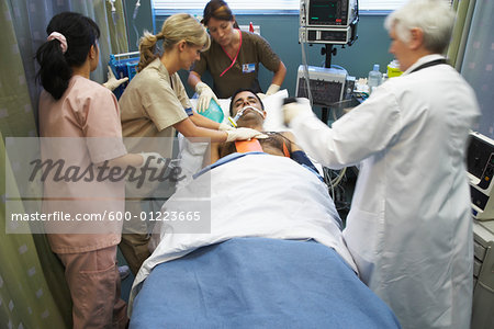 Doctor and Nurses Tending to Patient