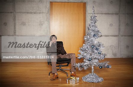 Portrait of Man with Christmas Tree