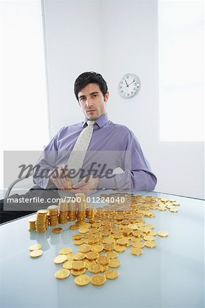 Homme d'affaires avec des pièces d'or