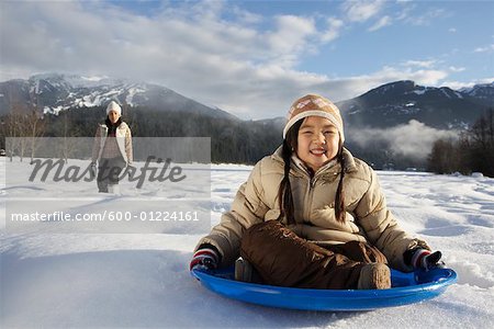 Mother and Daughter Sledding, Whistler, British Columbia, Canada
