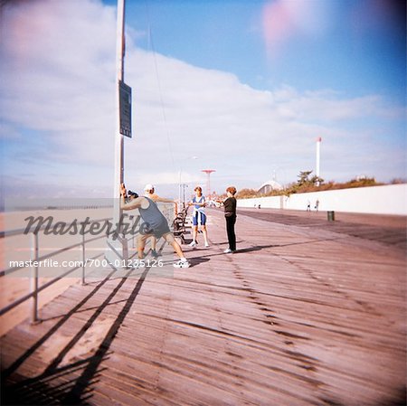 Runners on Boardwalk, Coney Island, New York, USA