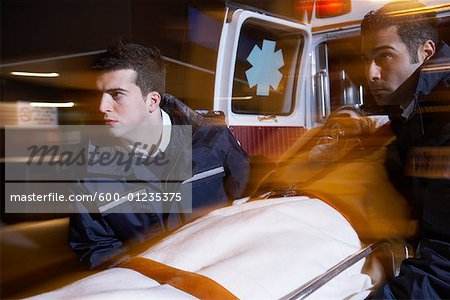 Paramedics Removing Patient From Ambulance