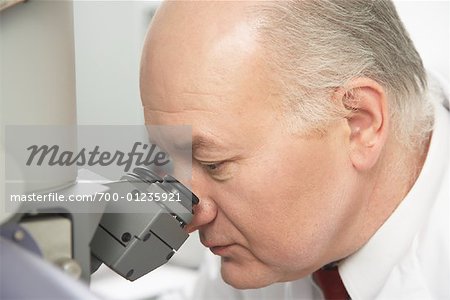 Technician Using Microscope