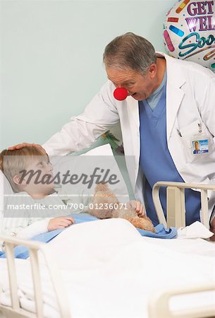 Doctor Talking to Boy in Hospital