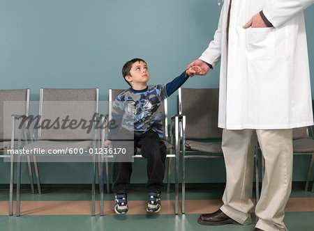 Doctor Holding Boy's Hand Doctor Holding Boy's Hand