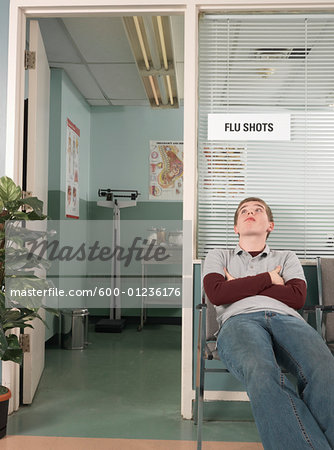 Teenaged Boy Waiting in Doctor's Office