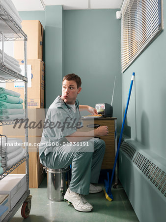 Doctor Taking a Break in Hospital Supply Room