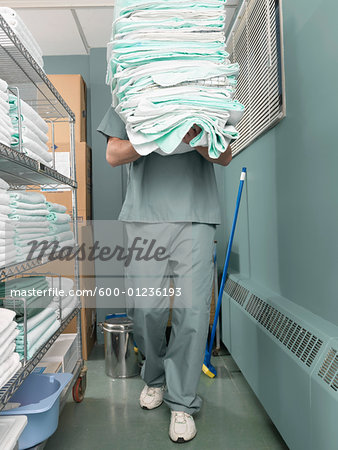 Hospital Worker Carrying Supplies