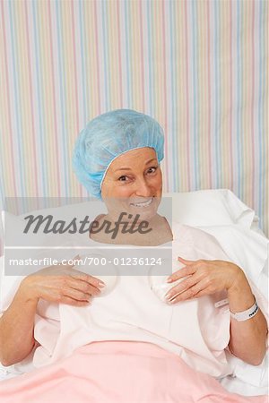 Portrait of Woman Holding Breast Implants
