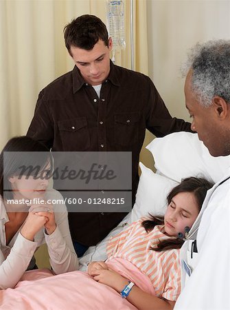 Doctor, Patient and Parents in Hospital Room