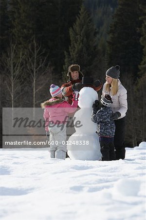 Family Making Snowman