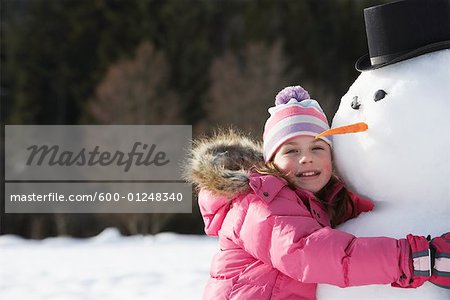 Girl Hugging Snowman