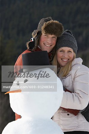 Portrait of Couple and Snowman