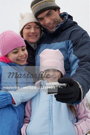 Father Taking Picture of Family