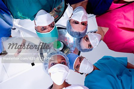 Low angle view of surgeons in an operating room