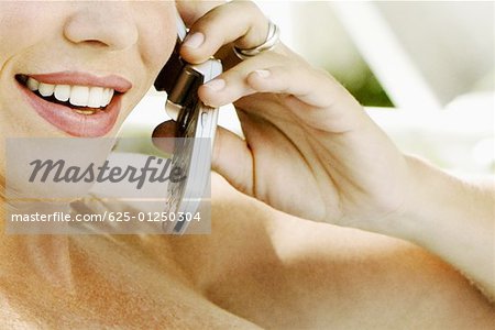 Close-up of a mid adult woman talking on a mobile phone