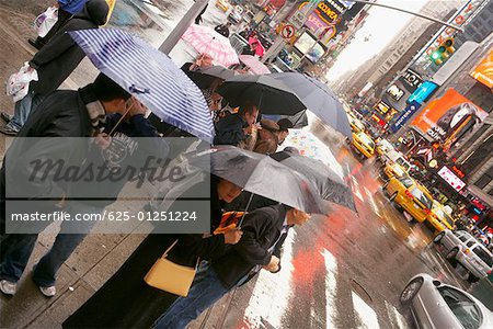 Tourists waiting at the roadside, New York City, New York State, USA