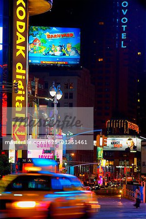 Buildings lit up at night in a city, New York City, New York State, USA
