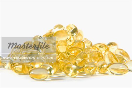 Close-up of a heap of vitamin E capsules